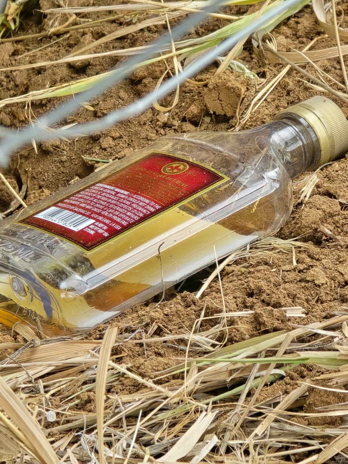 Empty liquor bottle found near the scene